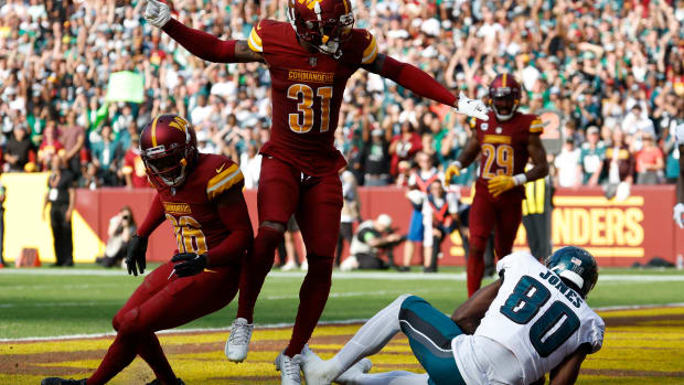 Oct 29, 2023; Landover, Maryland, USA; Philadelphia Eagles wide receiver Julio Jones (80) catches a touchdown pass as Washington Commanders safety Kamren Curl (31) and Commanders cornerback Danny Johnson (36) defend during the fourth quarter at FedExField. Mandatory Credit: Geoff Burke-USA TODAY Sports